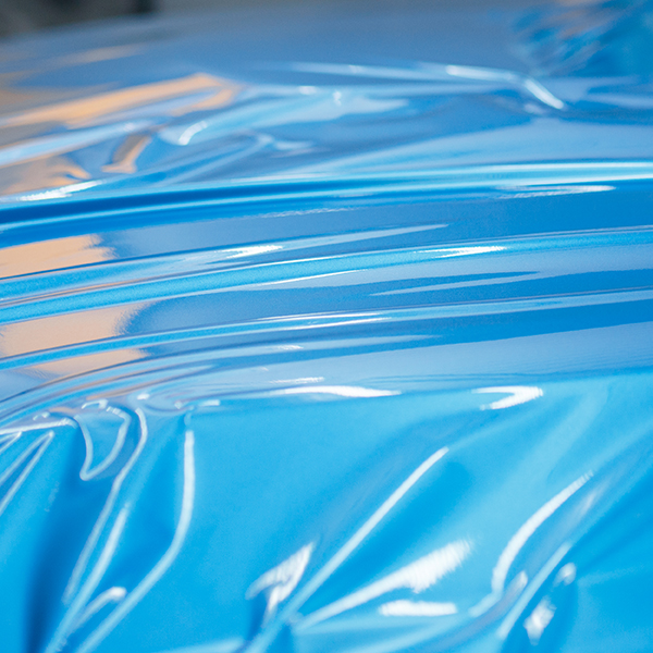 Car wrapper puts protective foil or film on hood